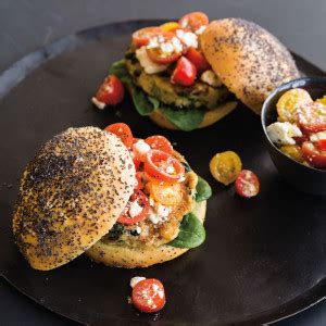 artichoke-spinach-burgers-with-tomato-feta-topping image