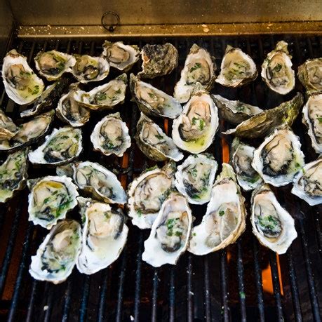 grilled-oysters-with-bacon-and-cayenne-butter-recipe-bon-apptit image