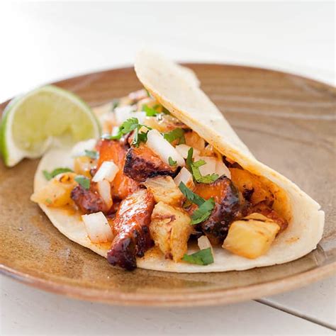 spicy-pork-tacos-al-pastor-americas-test-kitchen image