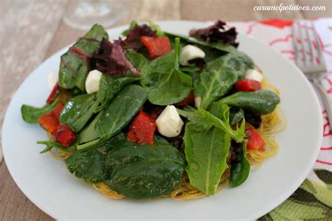 crispy-pasta-cake-with-red-pepper-and-mozzarella-salad image