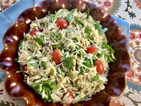 lemon-orzo-salad-with-spinach-tomatoes-and-pine image