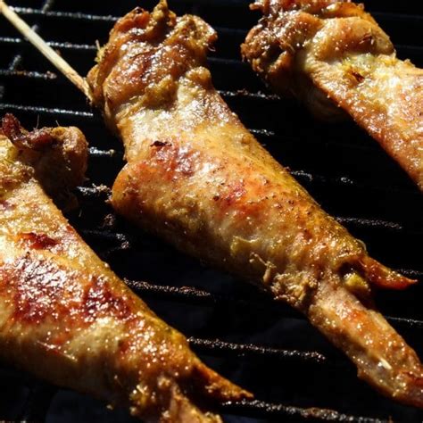 grilled-thai-curry-chicken-wings-pups-with-chopsticks image