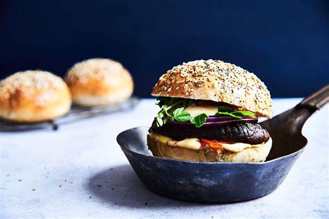 seeded-hamburger-buns-recipe-king-arthur-baking image