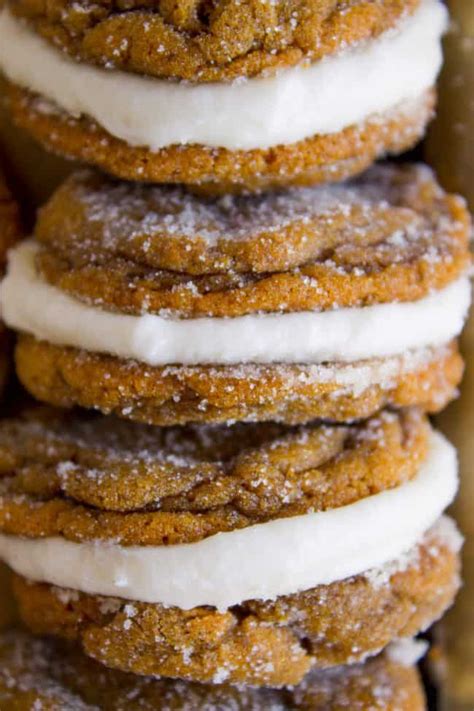 ginger-molasses-sandwich-cookies-with-frosting-the-food image