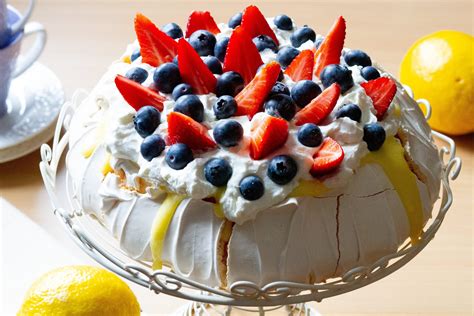pavlova-with-lemon-curd-whipped-cream-and-fruits image