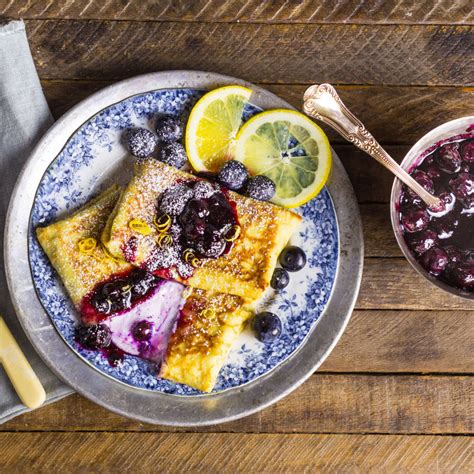 cheese-and-blueberry-blintzes-with-blueberry-preserves image