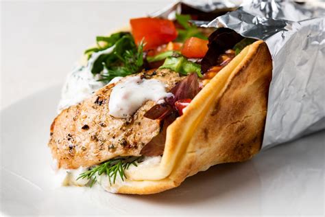 greek-chicken-souvlaki-gyro-wrap-recipe-the-spruce image