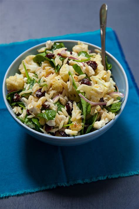 orzo-salad-with-roasted-cauliflower-spinach-and-feta image