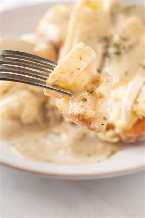 open-faced-turkey-sandwich-with-gravy-a-table-full image