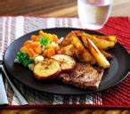 pork-chops-with-potato-wedges-tesco-real-food image
