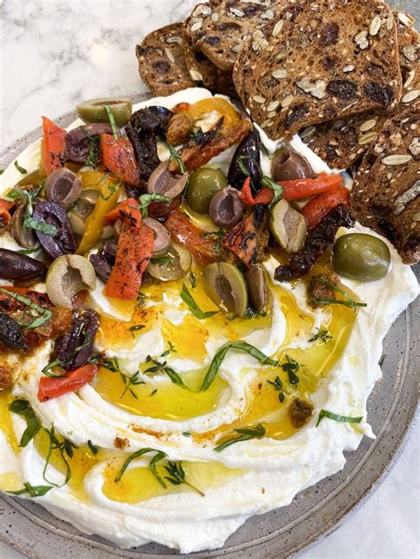 goat-cheese-spread-with-sun-dried-tomatoes-olives image