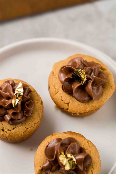 peanut-butter-cookie-cups-with-a-silky-chocolate-frosting image