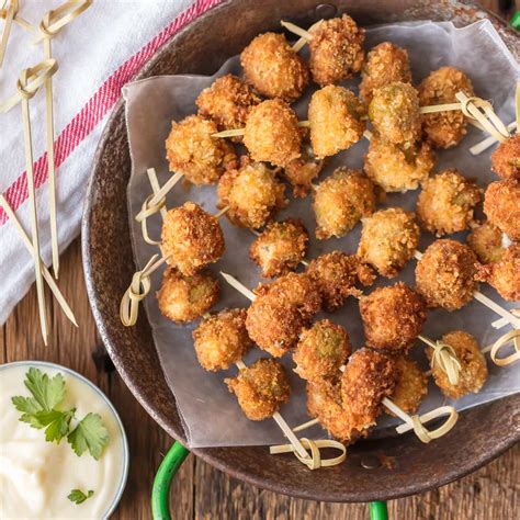 fried-blue-cheese-stuffed-olives-with-garlic-aioli-dip image
