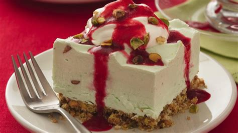 frozen-pistachio-cream-dessert-with-ruby-raspberry image