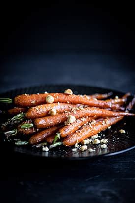 honey-roasted-dutch-baby-carrots-hazelnuts image