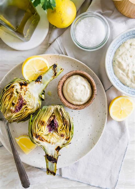 grilled-artichokes-with-lemon-herb-tahini-dipping-sauce image