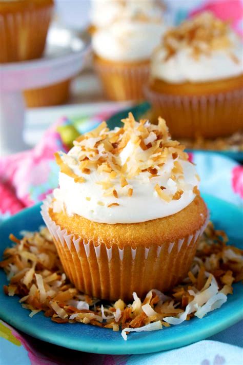 coconut-cupcakes-with-coconut-swiss-meringue image