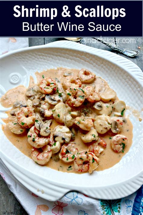 mixed-seafood-in-wine-butter-sauce-spinach-tiger image