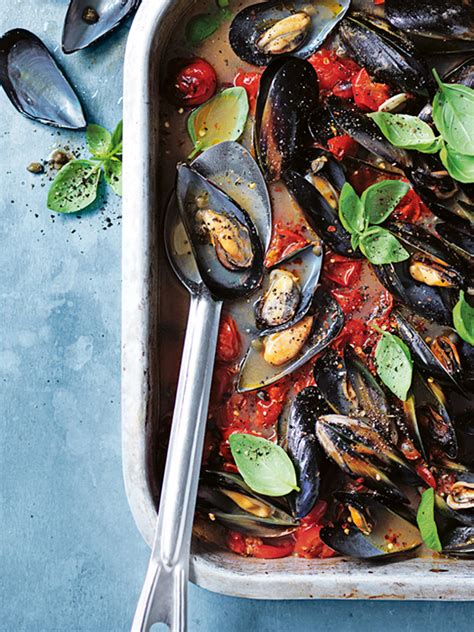 baked-mussels-with-tomato-and-capers-donna-hay image