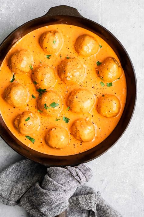 vegan-chickpea-meatballs-in-roasted-red-pepper-sauce image