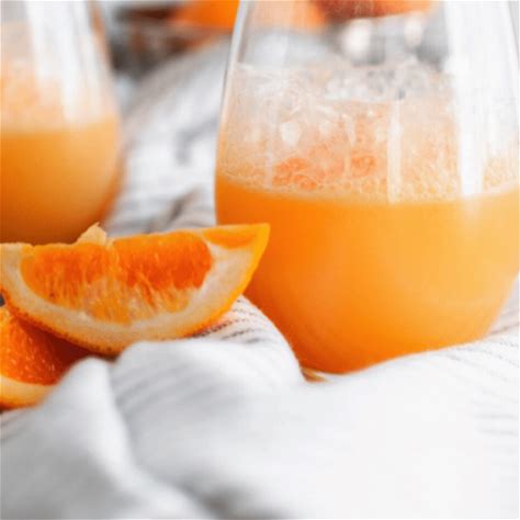 orange-sherbet-punch-with-7up-orange-juice image