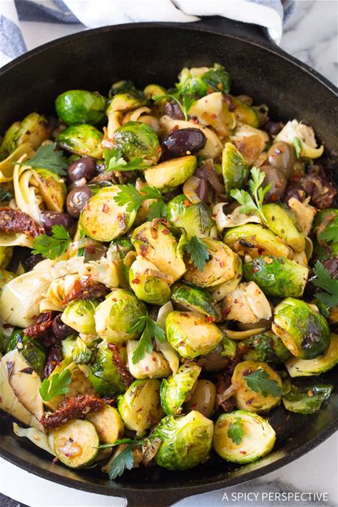 braised-brussels-sprouts-with-sun-dried-tomatoes image