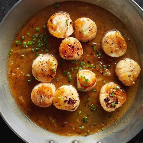 pan-seared-scallops-with-citrus-glaze-recipe-yummly image