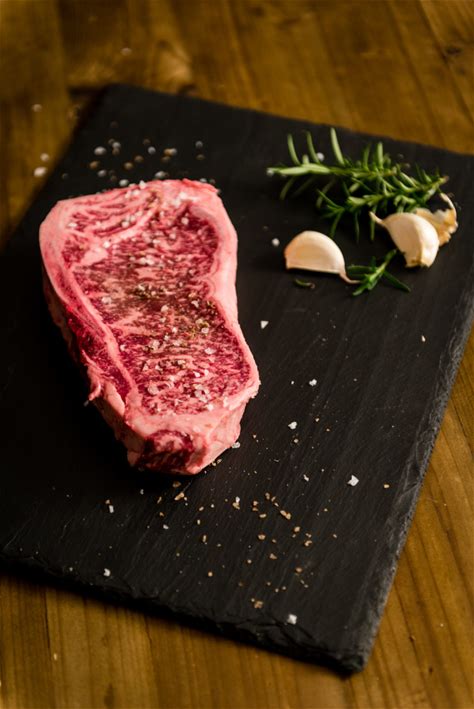 pan-seared-new-york-strip-steak-and-scallops-girl image