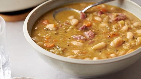 herby-ham-and-bean-soup-recipe-tasting-table image