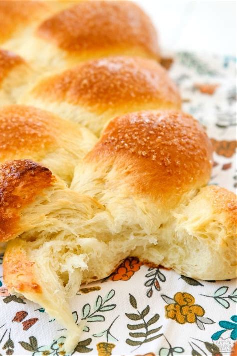 braided-sweet-bread-butter-with-a-side-of-bread image