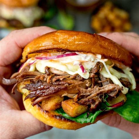 brisket-sandwich-with-garlic-saut-potatoes-and-coleslaw image