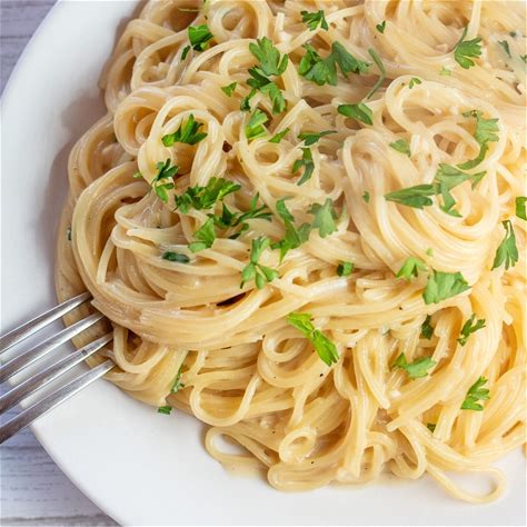 garlic-parmesan-angel-hair-pasta-bake-it-with-love image