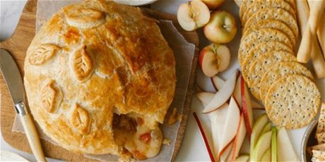 giant-baked-brie-with-apricots-and-walnuts-food image