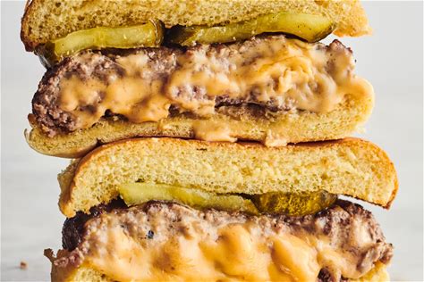juicy-lucy-burgers-recipe-stuffed-with-american-cheese image