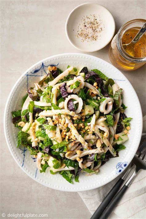 grilled-squid-salad-with-fresh-herbs-delightful-plate image