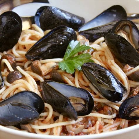 mussel-pasta-italian-recipe-with-olives-and-tomatoes image