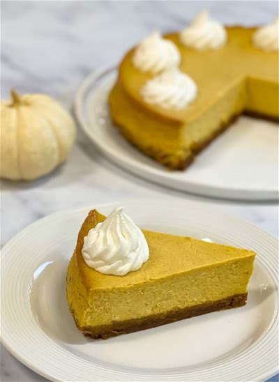 pumpkin-cheesecake-with-gingersnap-cookie-crust image