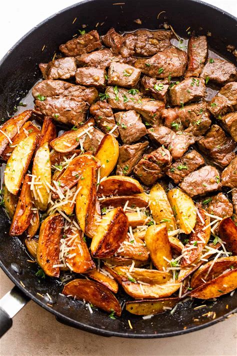 juicy-garlic-steak-bites-parmesan-potatoes-easy image