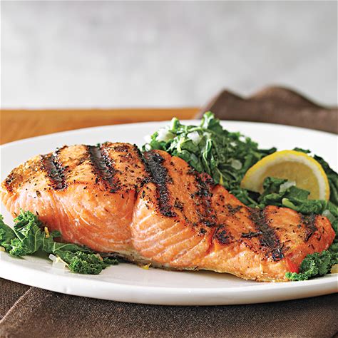 grilled-salmon-with-kale-saut-eatingwell image