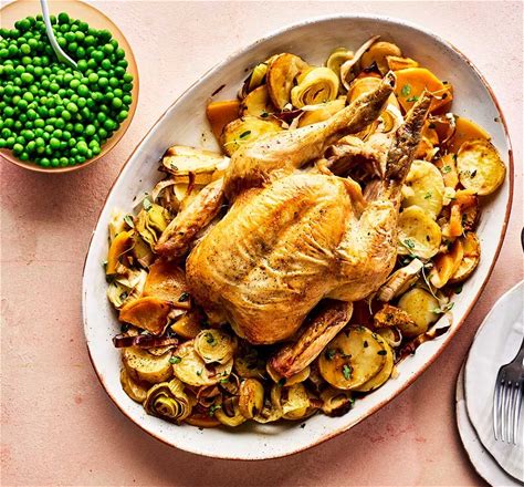 whole-roast-chicken-with-braised-roots-peas-bbc image