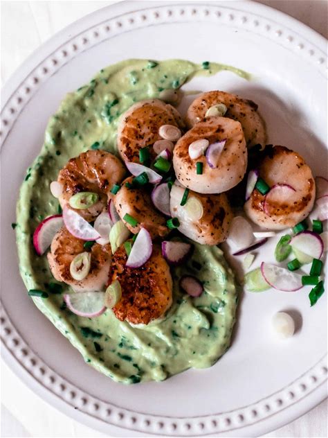 seared-scallops-with-avocado-cream-whisked-away image
