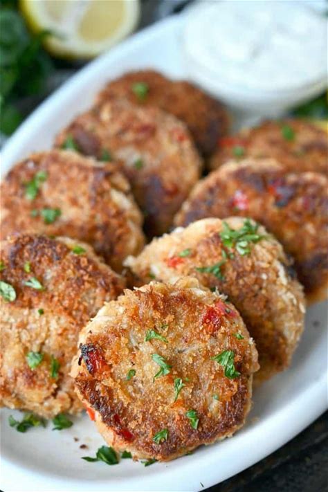 crab-cakes-with-lemon-dill-sauce-butter-your-biscuit image