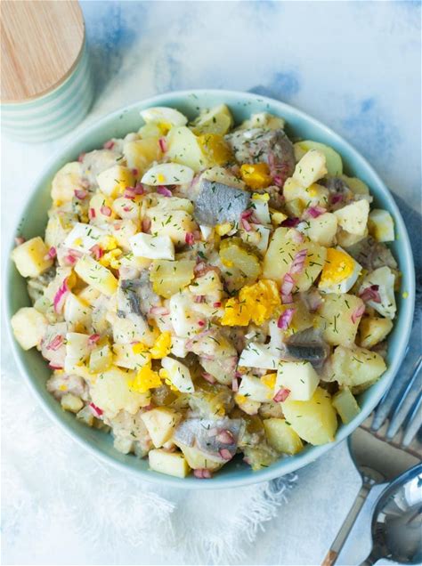 herring-salad-with-potatoes-eggs-pickles-and-apples image
