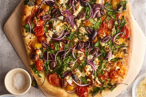 greek-pizza-with-spinach-feta-and-olives-recipe-kitchn image