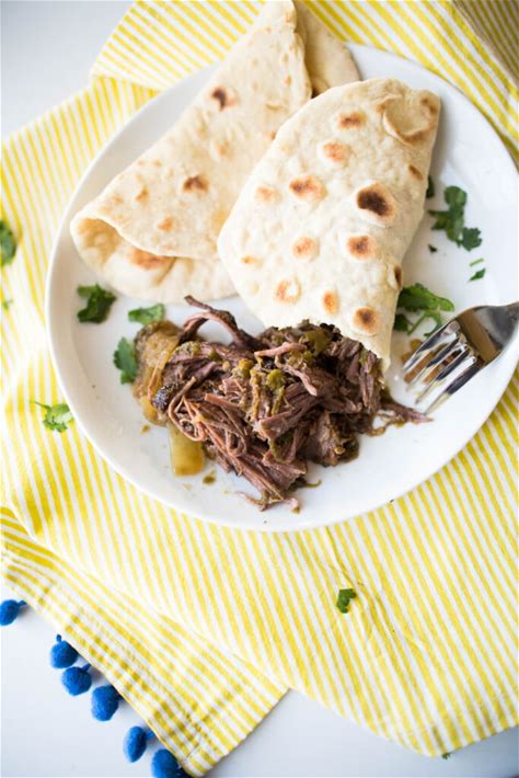 slow-cooker-green-chile-shredded-tacos-cooking image