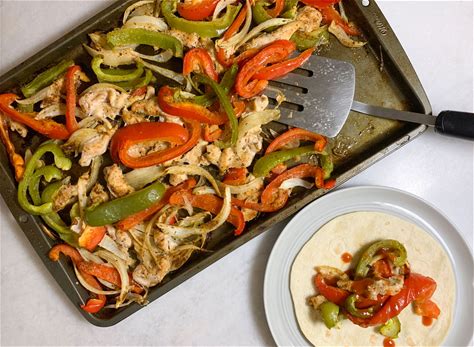 an-easy-sheet-pan-chicken-fajitas-recipe-eat-this image