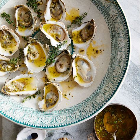 grilled-oysters-with-garlic-herb-butter-eatingwell image