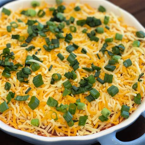 easy-layered-nacho-dip-the-cookin-chicks image