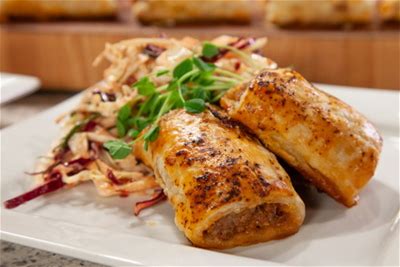 chorizo-sausage-rolls-with-cranberry-apple-slaw image