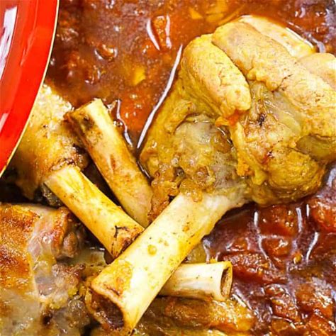 tangy-moroccan-lamb-shank-tagine-with-apricots image